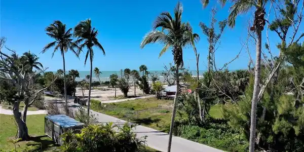 Image 2: View of street featuring a water view
