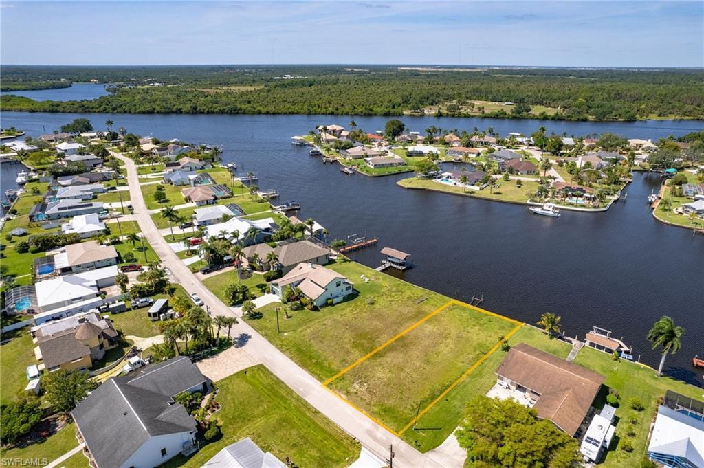 Image 2: Birds eye view of property with a water view