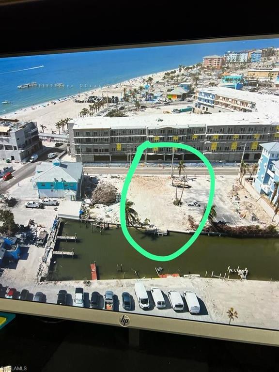 Image 1: Drone / aerial view with a water view and a beach view