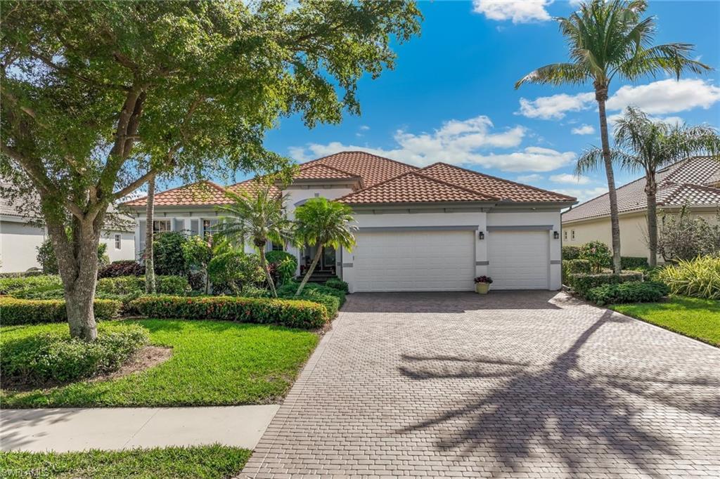 Image 2: Three-car garage with a fresh expoxy floor.