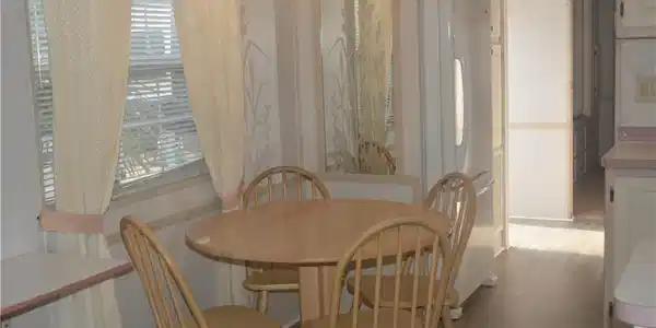 Image 2: Dining space featuring a notable chandelier and light wood finished floors