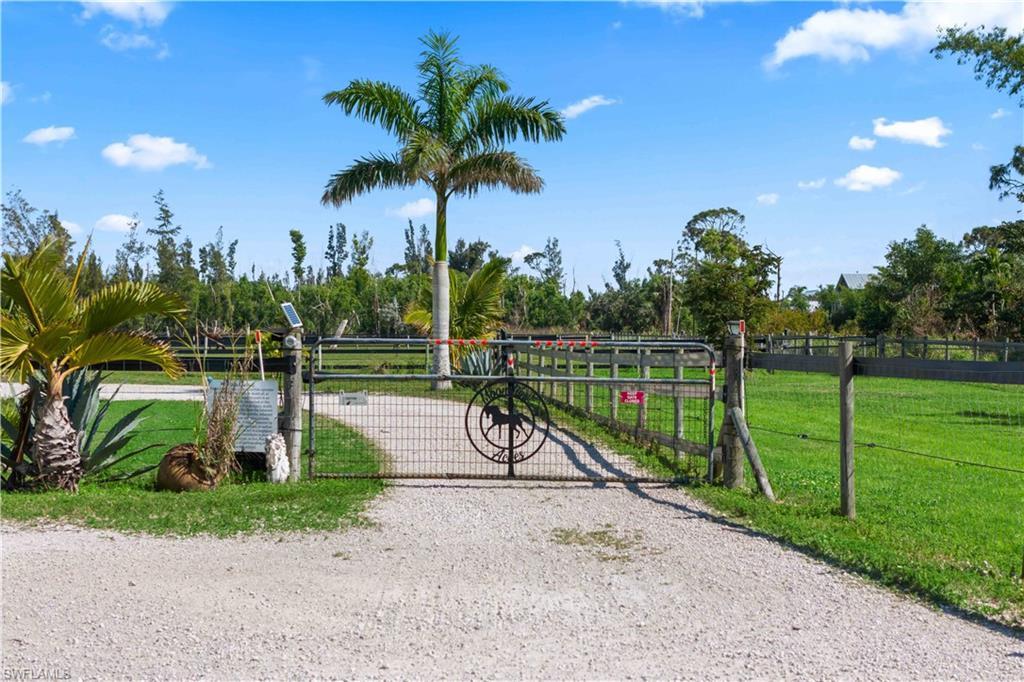 Image 4: Fully fenced and surrounded by the sparkling waters of the Gulf, this private, tropical sanctuary offers direct access to over 12 miles of scenic trails.