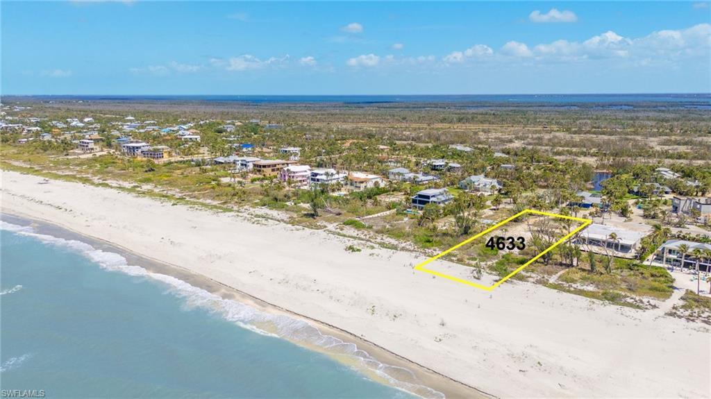 Image 3: Drone / aerial view with a beach view and a water view