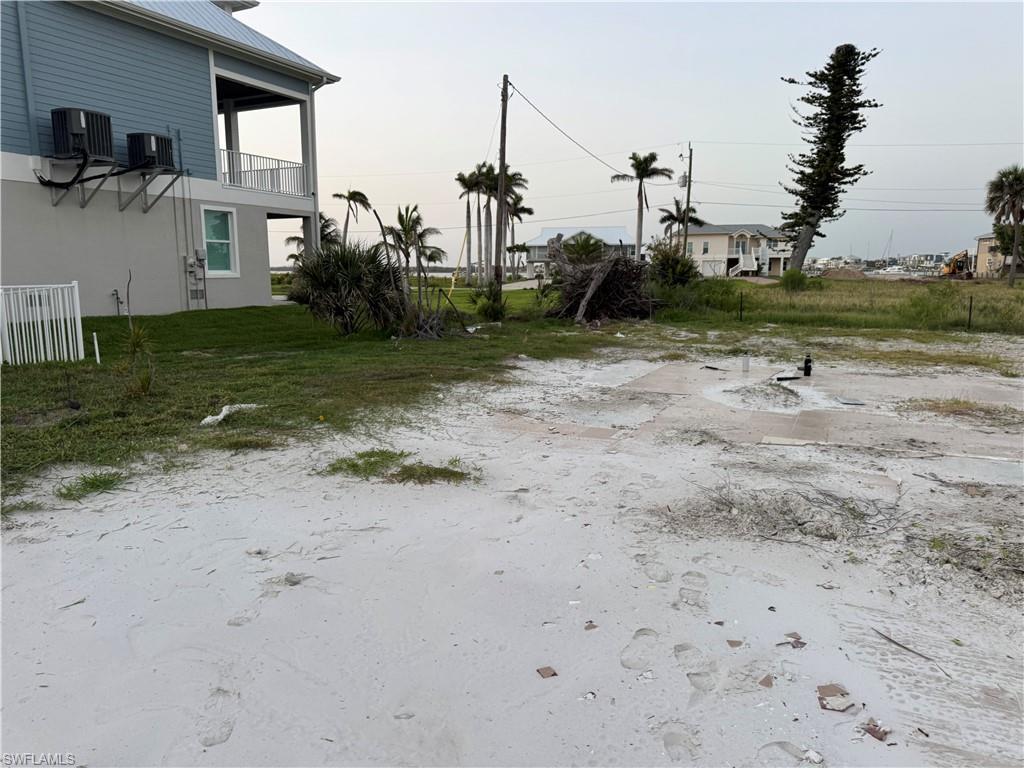 Image 3: View of yard featuring a balcony