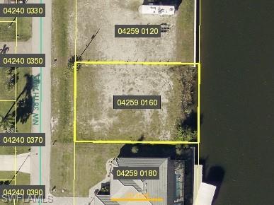 Image 1: Aerial overview of property's location featuring property parcel outlined