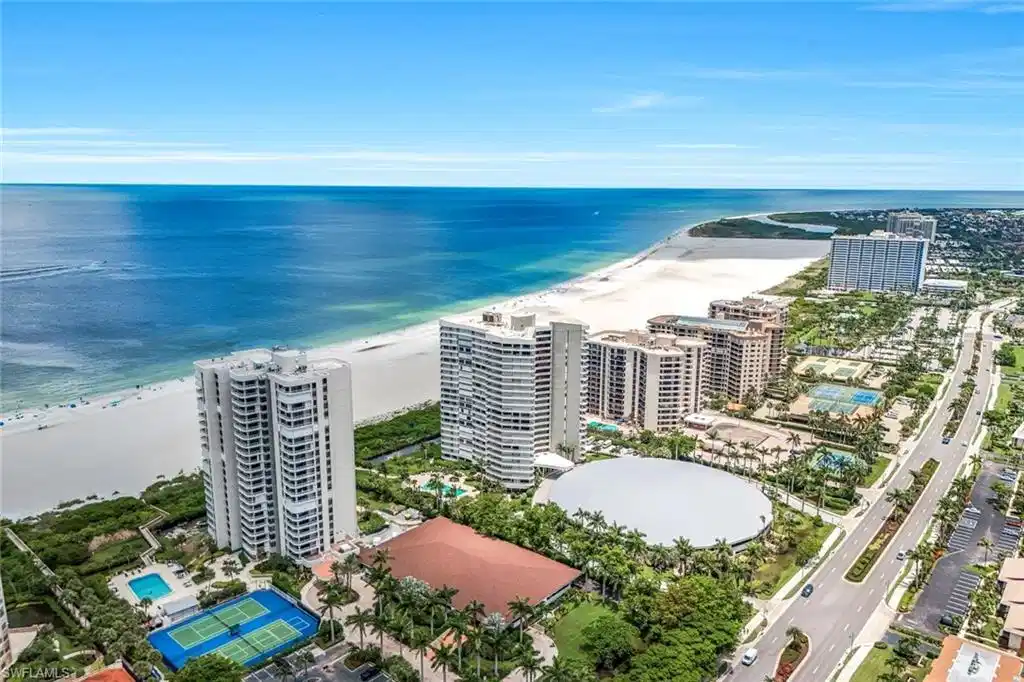 Image 1: View of urban area featuring unending shoreline