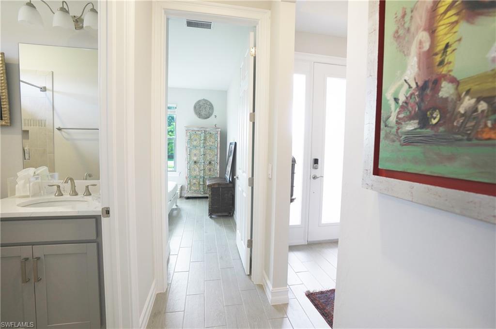 Image 3: Hallway featuring sink
