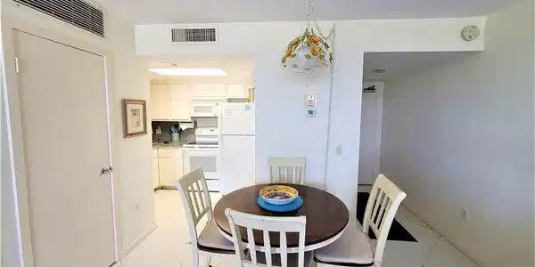 Image 2: Dining room featuring light tile patterned flooring and a textured ceiling