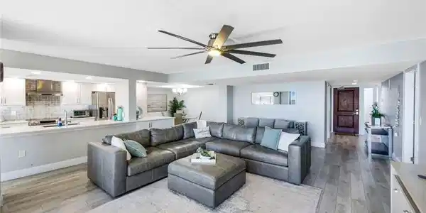 Image 2: Living room featuring light wood-style flooring, ceiling fan, recessed lighting, and a chandelier