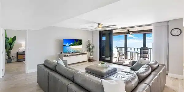 Image 3: Living room featuring ceiling fan, light wood-type flooring, and floor to ceiling windows