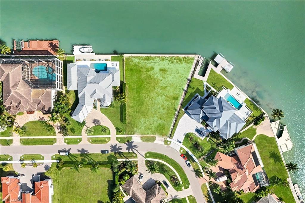 Image 2: Large .54 acre lot with new seawall, ideal for building your dream home in the prestigious Estates section of Marco Island