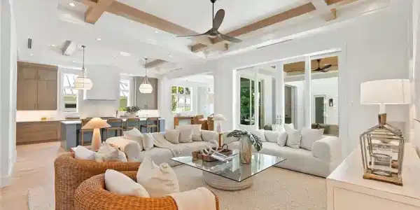 Image 3: Living room with beam ceiling, a ceiling fan, and light wood-style floors
