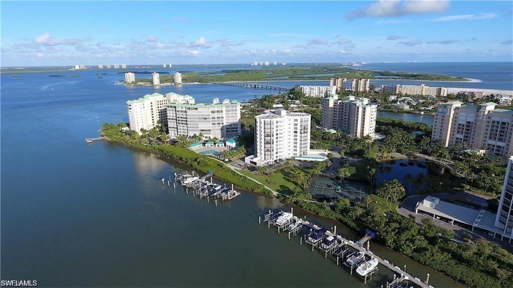 Image 3: Aerial view highlighting the building&rsquo;s prime waterfront setting and proximity to the beach.