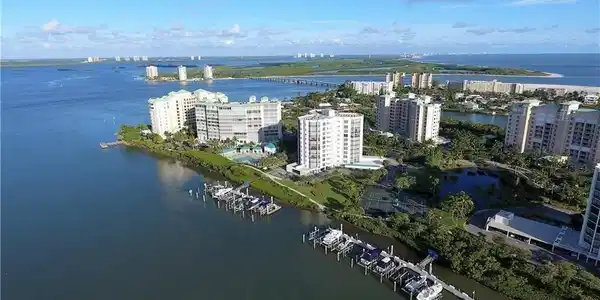 Image 3: Aerial view highlighting the building&rsquo;s prime waterfront setting and proximity to the beach.