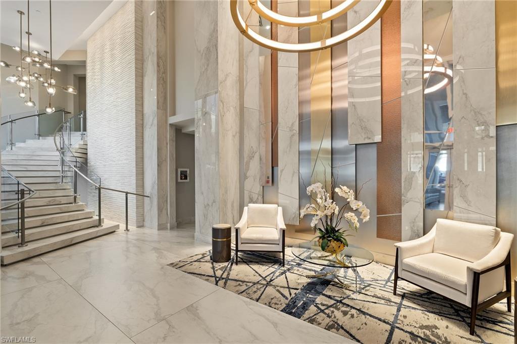 Image 4: Elegant lobby with marble staircase