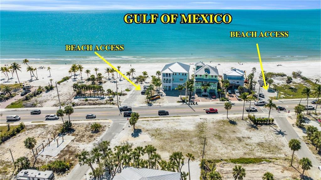 Image 2: Aerial view featuring a view of the beach and a water view VIRTUALLY EDITED