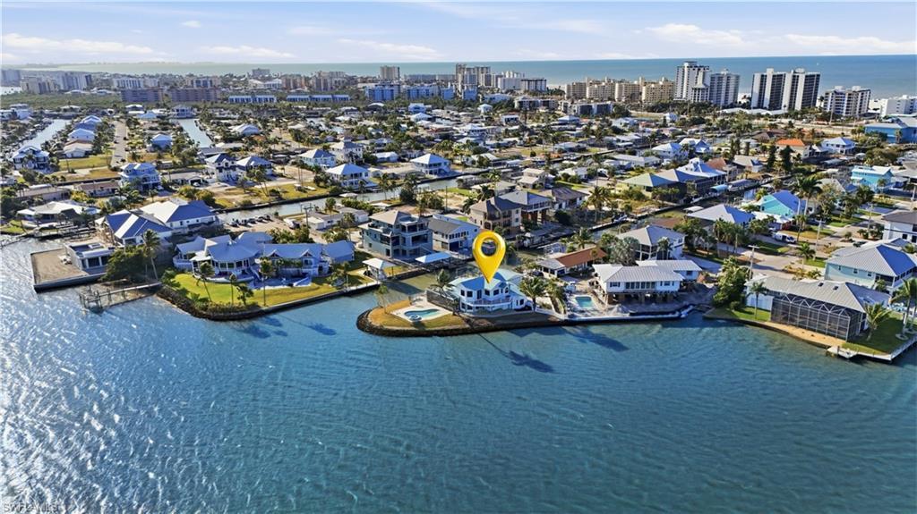 Image 3: View of urban area with a large body of water and nearby suburban area - Virtually Edited Image