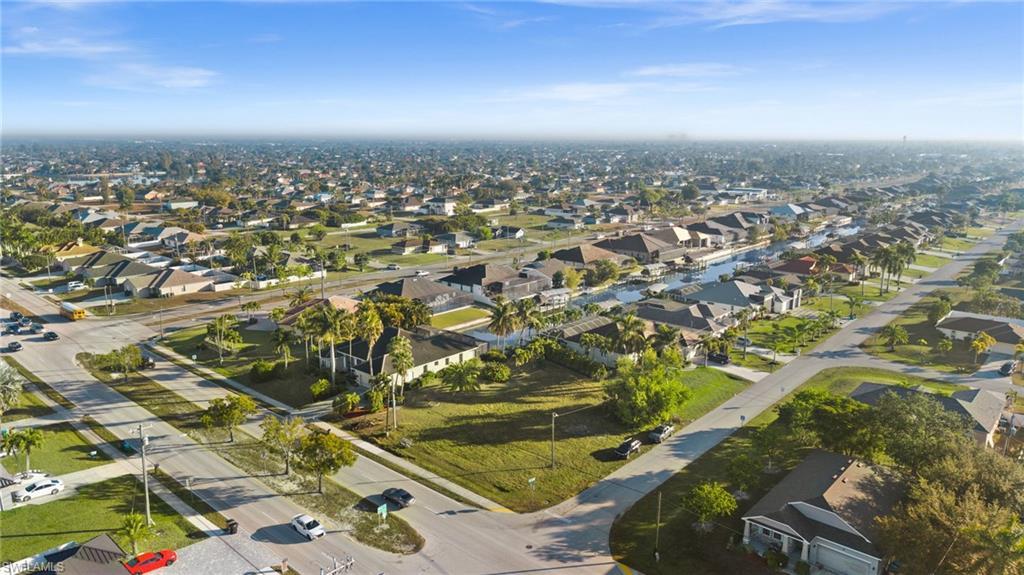 Image 4: Aerial view of property and area featuring nearby suburban area