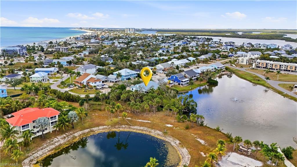 Image 3: Aerial view of property's location featuring a large body of water - Virtually Edited Image