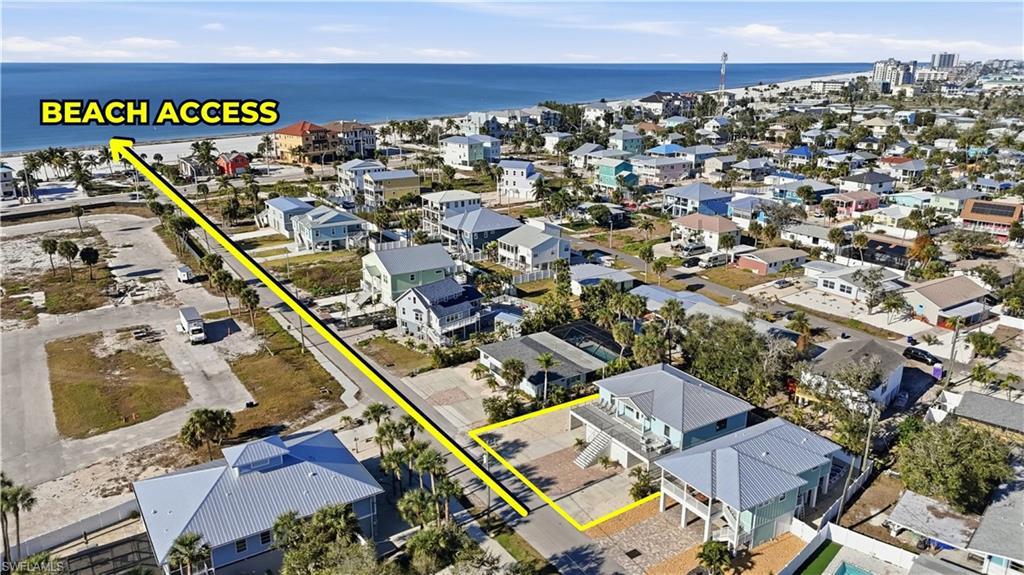 Image 2: Aerial view of property and surrounding area with a nearby body of water - Virtually Edited Image