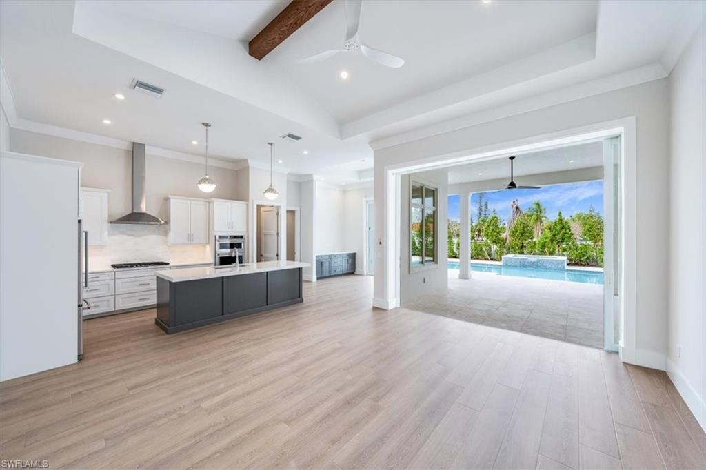 Image 4: Open the front door to see straight out to thepool through 3-panel full pocket 10' impactPGT sliders from the great room.