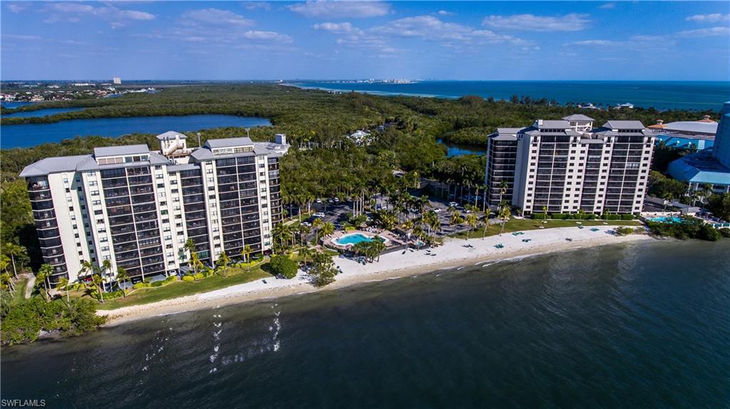 Image 1: Drone / aerial view with a water view and a beach view