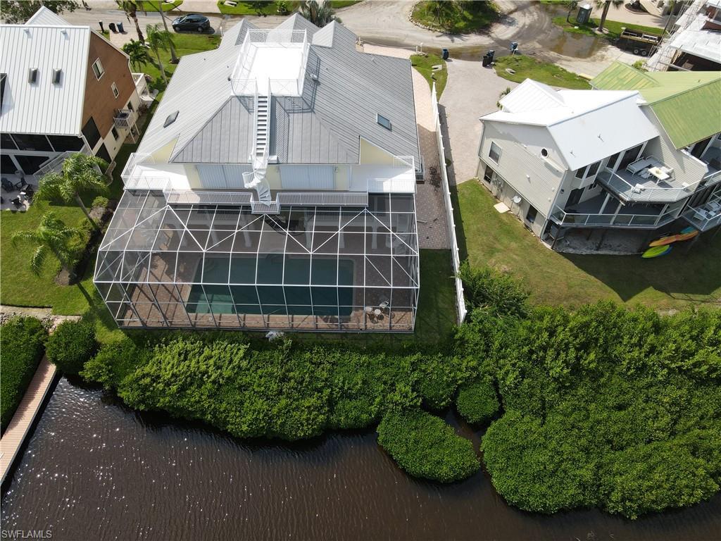 Image 1: Birds eye view of property with a water view