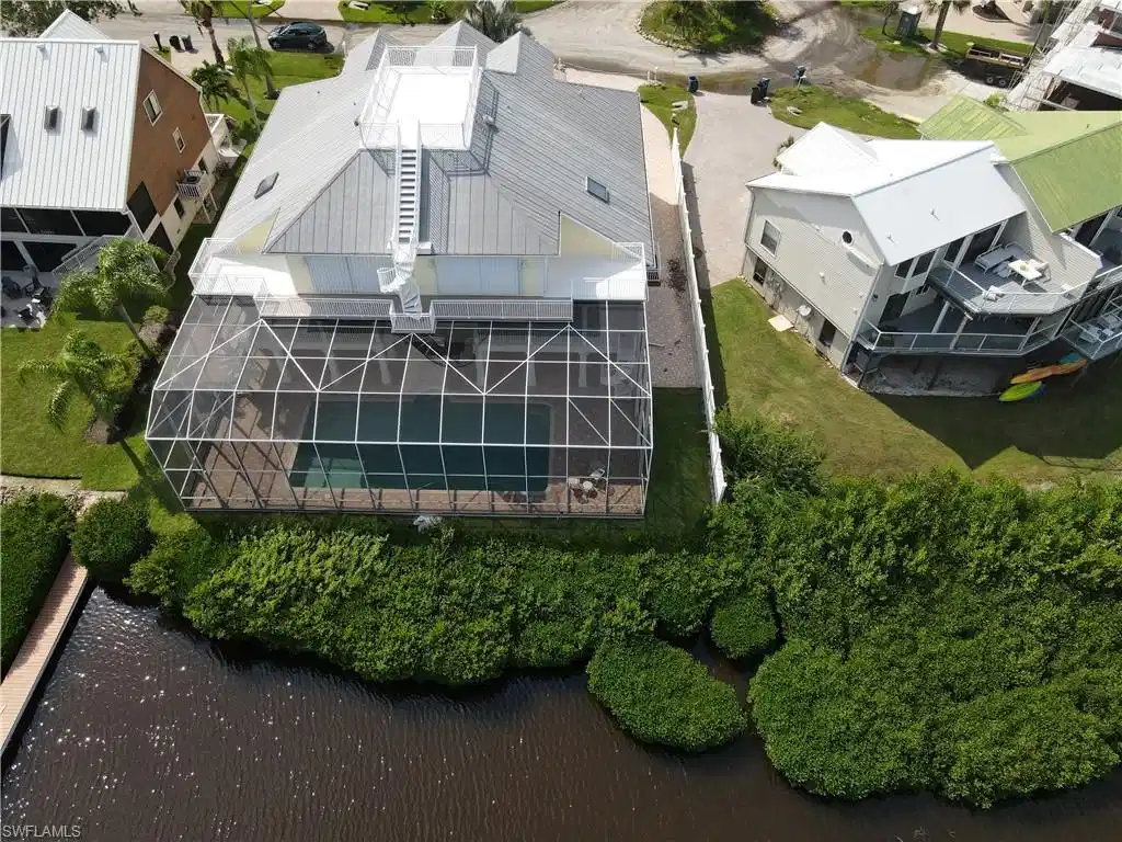 Image 1: Birds eye view of property with a water view