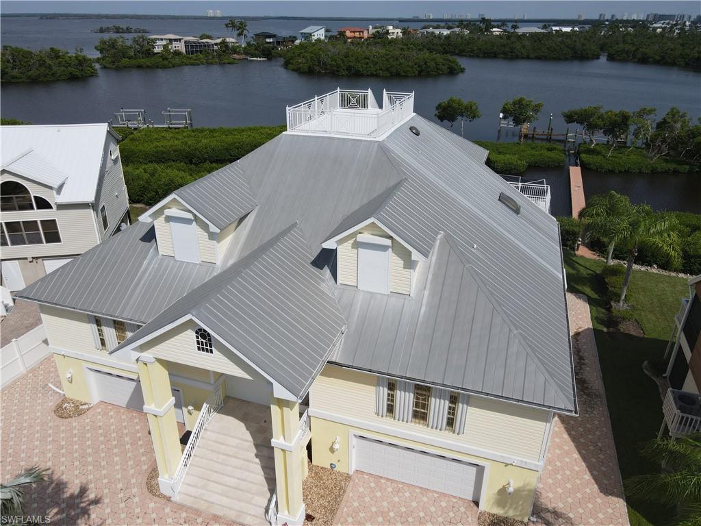 Image 3: Birds eye view of property with a water view