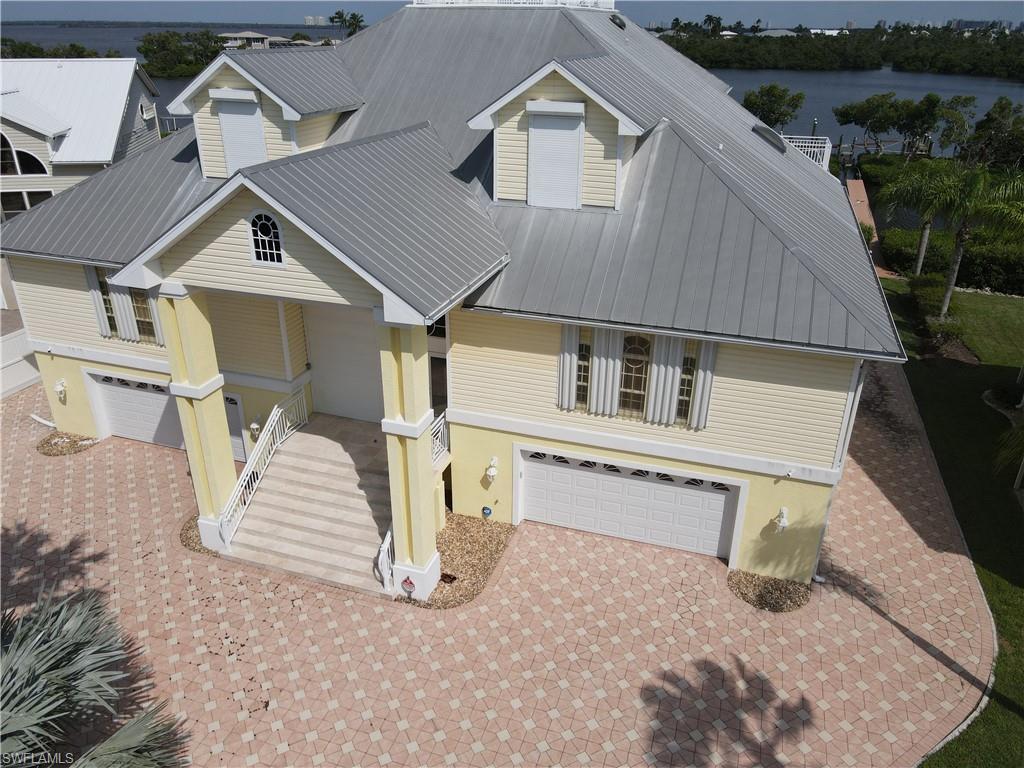 Image 4: View of front of property featuring a garage