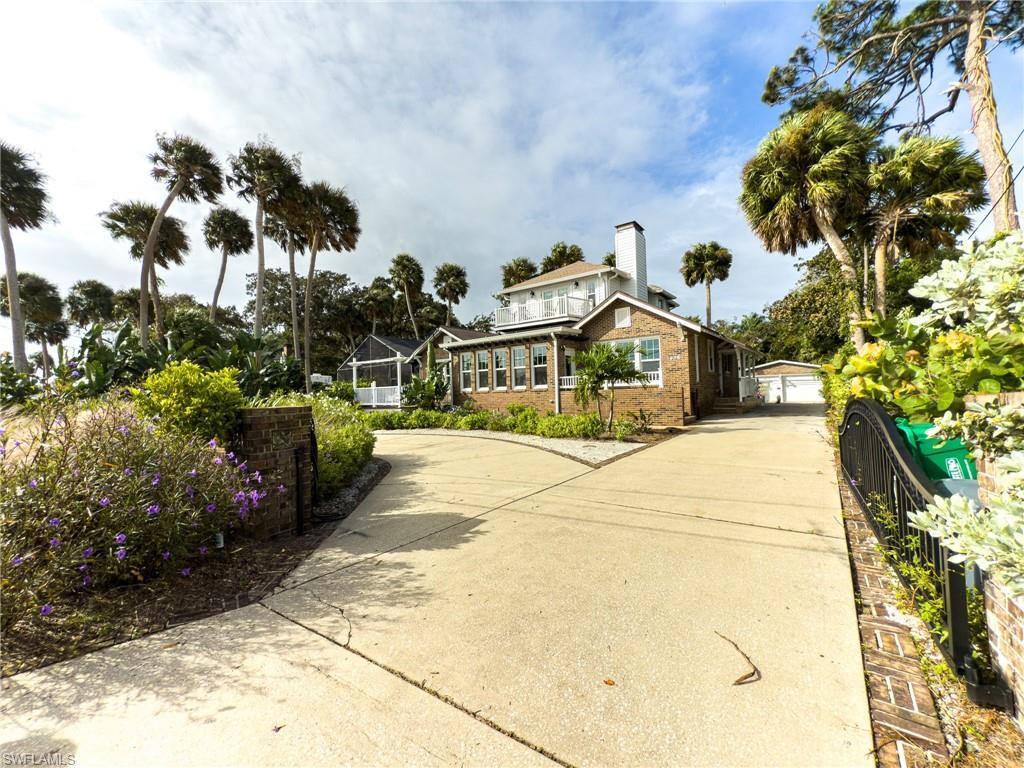 Image 2: View of front of house featuring concrete driveway