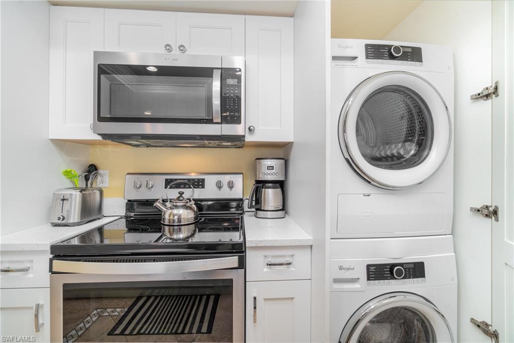 Image 3: Laundry room with stacked washer and clothes dryer