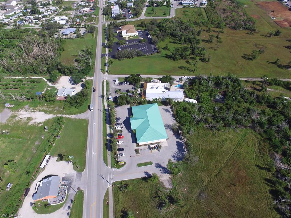 Image 4: Aerial view of property and surrounding area
