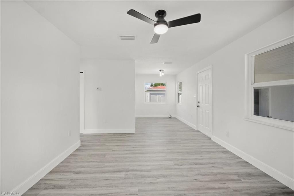 Image 4: Empty room featuring light wood finished floors and a ceiling fan