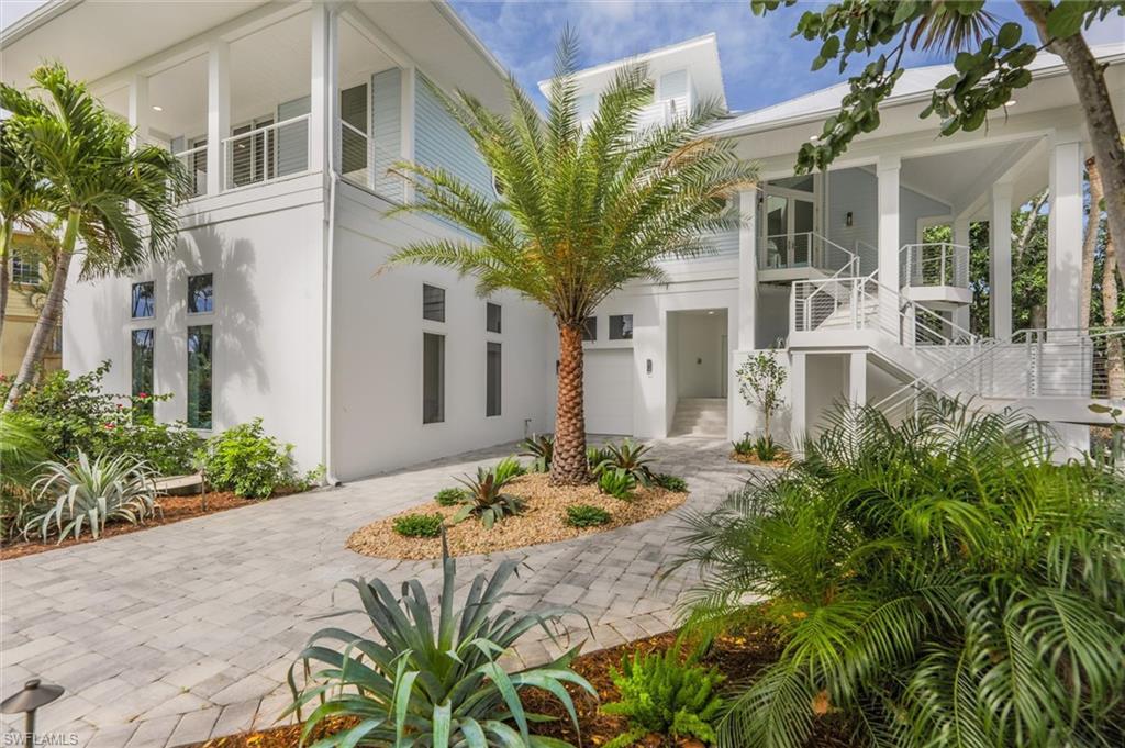 Image 1: View of front of house with a garage