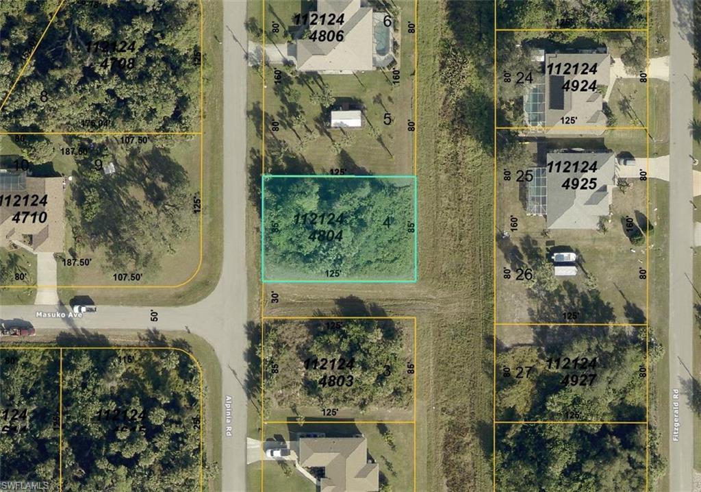 Image 2: Aerial view of property's location featuring property parcel outlined