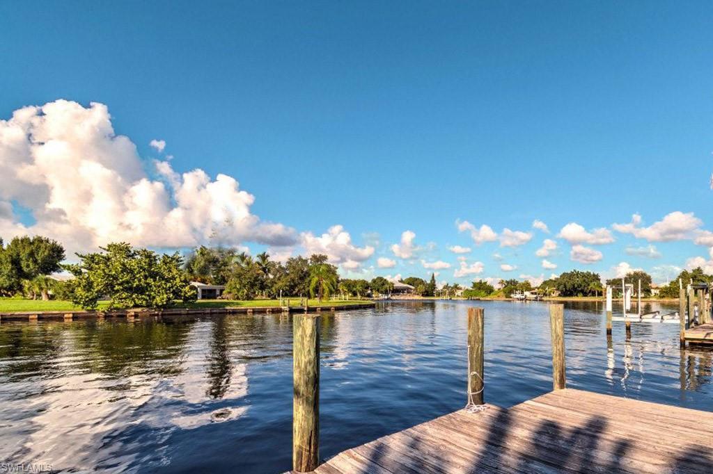 Image 4: Dock featuring a water view