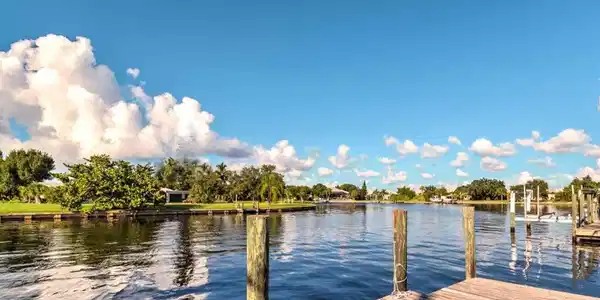 Image 4: Dock featuring a water view