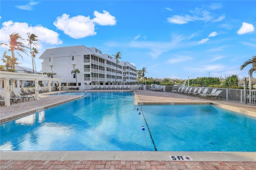 Image 4: View of swimming pool with a patio area