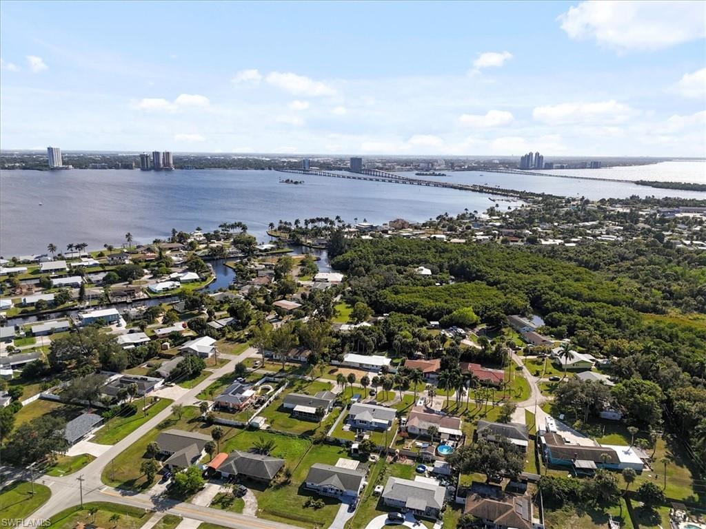 Image 3: Aerial overview of property's location with a notable bridge and nearby suburban area