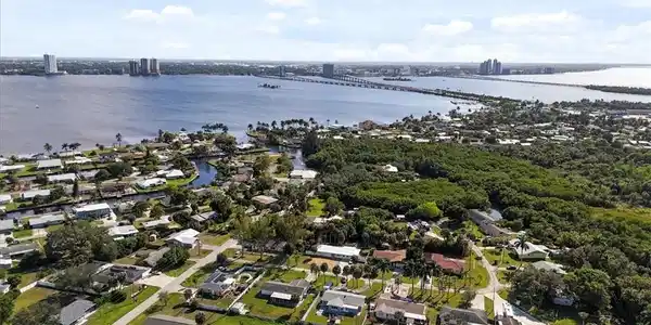 Image 3: Aerial overview of property's location with a notable bridge and nearby suburban area