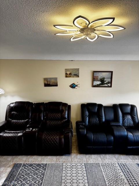 Image 3: Living area featuring a textured ceiling