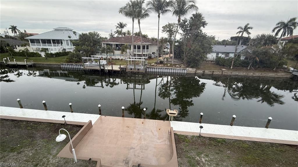 Image 3: Dock featuring a water view