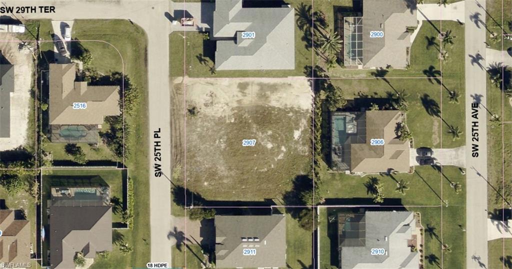 Image 2: Aerial overview of property's location featuring property parcel outlined