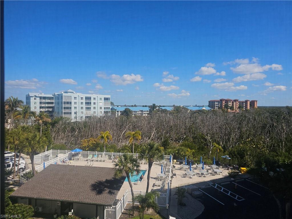 Image 2: View from balcony of community pool, preserve & bay
