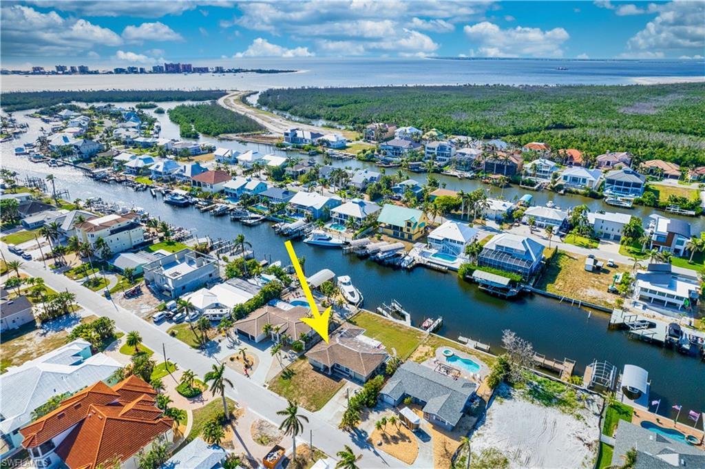 Image 2: Aerial view featuring a water view.  Looking out to North end of Ft. Myers Beach