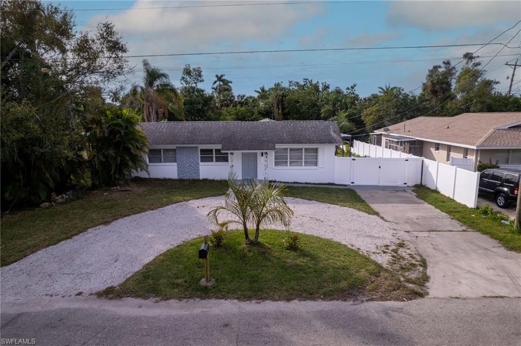 Image 2: Single story home with a front yard