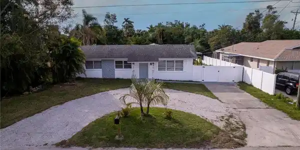 Image 2: Single story home with a front yard