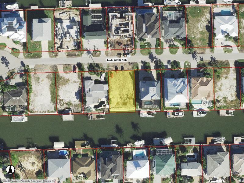 Image 3: Aerial image of 318 Trade Winds Ave - southern exposure from the future swimming pool and boat dock