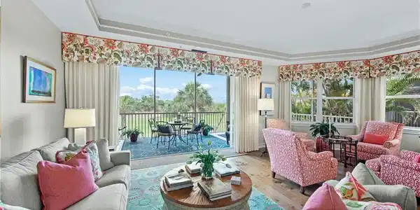 Image 4: Living room featuring wood-type flooring and a tray ceiling